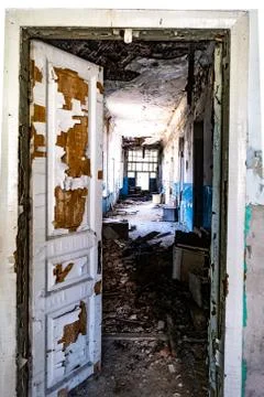 Aged corridor of old asylum Stock Photos