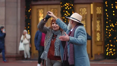 Aged couple dancing on the street Stock Footage 147531704