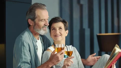 Aged couple drinking wine Stock Footage 148407790