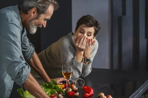 Aged couple in the kitchen Stock Photos
