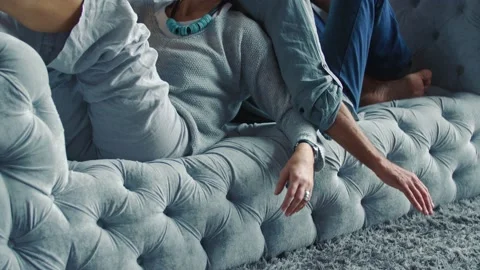 Aged couple sitting on the couch Stock Footage 146754097