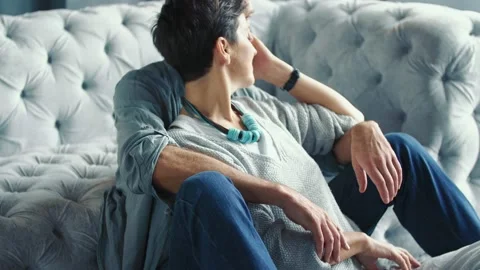Aged couple sitting on the sofa Stock Footage 149346259