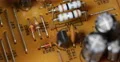Aged Electronic Components Outdated Yellow Board Closeup Old Circuits Background 4k or 4k+ Resolution