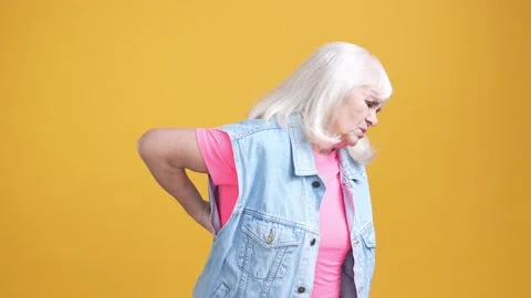 Aged lady suffer terrible back ache massage isolated shine color background Stock Footage 189927593