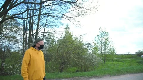 Aged man in black mask asks girl riding scooter to stop Stock Footage 131254224