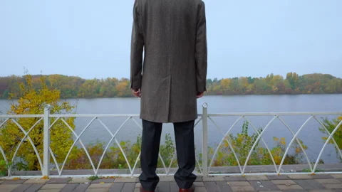 Aged man in coat fall scene Stock Footage 150204360