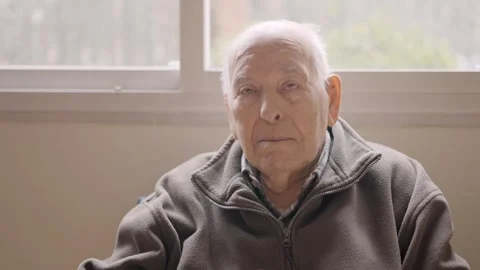 Aged man looking serious sitting on a geriatric Stock Footage 268747346
