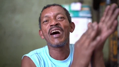 Aged Man Singing and Playing Samba with Hands Stock Footage 84762226