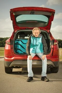 Aged man working as digital platform food delivery in duty Stock Photos