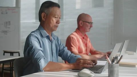 Aged Men Using Laptops during Computer Class Stock Footage 263701167
