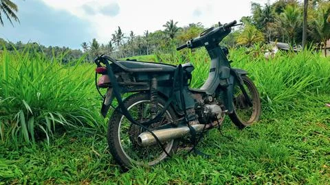 Aged modified motorcycle Stock Photos