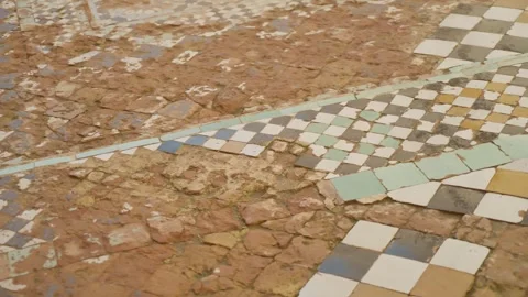 Aged Mosaic Tile Floor with Geometric Patterns in Historic Marrakesh, Morocco Stock Footage 342681532
