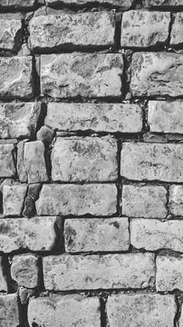 Aged Old Brick Wall Texture. Grunge Backdrop or Wallpaper. Black and white Photo Foto stock