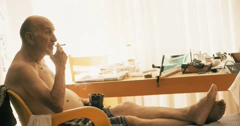 An aged, old man is in depression. Tired man concept with stress, smoking old Stock Footage 136762036
