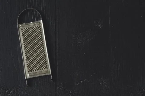 Aged old rustic grater Stock Photos