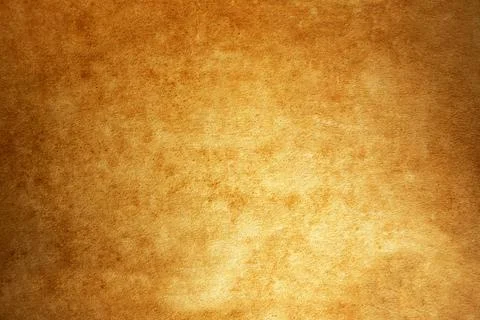 Aged parchment texture surface with golden brown rustic paper background Stock Photos