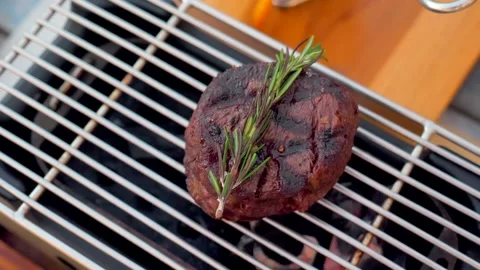 Aged prime beef fillet roasting on the grill, seasoned with herbs and spices Stock Footage 236773091