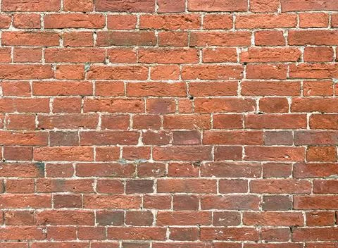 Aged red brick wall background. Сloseup. Space for text. Stock Photos
