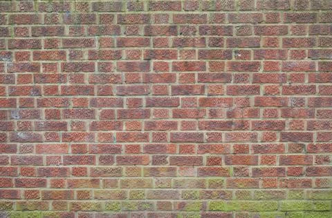 Aged red brick wall texture. Old textured grunge wall surface. Stock Photos