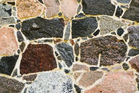 Aged Stone Wall. Old Stone Wall Background of Ancient Stones Stock Photos