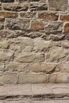 Aged stone wall Stock Photos