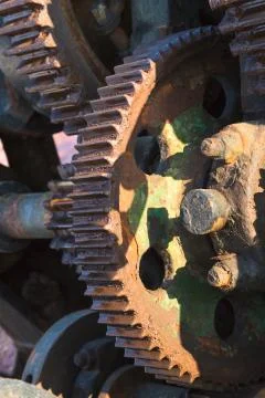 Aged technology: old and rusty gearwheel on an old ship - retro and vintage l Stock Photos