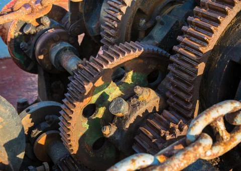 Aged technology: old and rusty gearwheel on an old ship - retro and vintage l Stock Photos