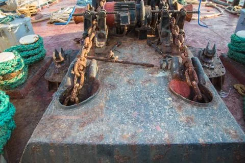 Aged technology: old and rusty gearwheel on an old ship - retro and vintage l Stock Photos
