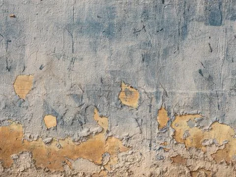 Aged texture of an old wall with a peeling light-blue paint and stucco Stock Photos
