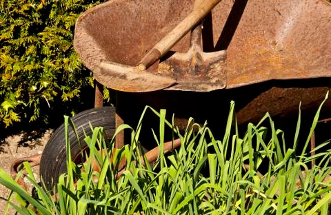 The aged wheelbarrow Stock Photos