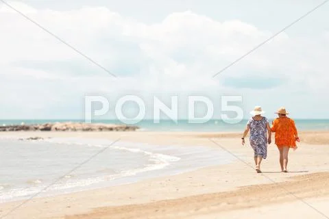 Aged woman couple walking Stock Photos