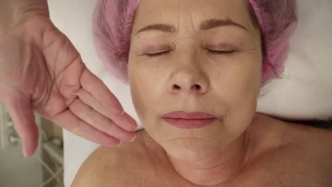 Aged woman's face after a face lifing procedure Stock Footage 73937837