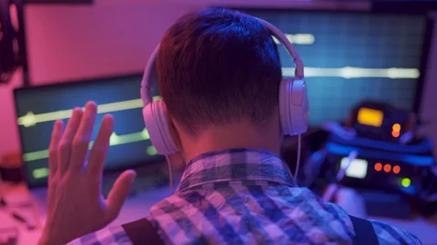 Agent asks for quiet, listen to conversation sound on headphones - investigation Stock-Footage 129303778