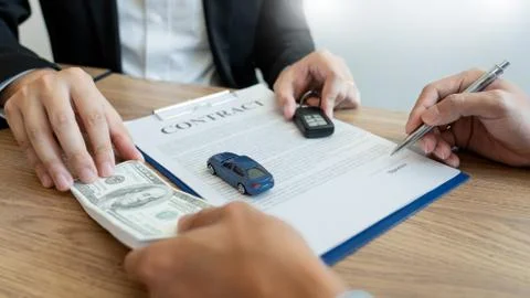Agent broker man holding document showing an transportation contract form to Stock Photos
