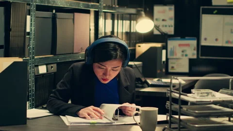 Agent conducts linguistic analysis of conversations to decipher coded messages Stock Footage 267488546