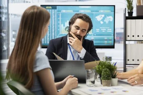 Agent preparing portfolio economic evolution summary for customer on notebook Stock Photos