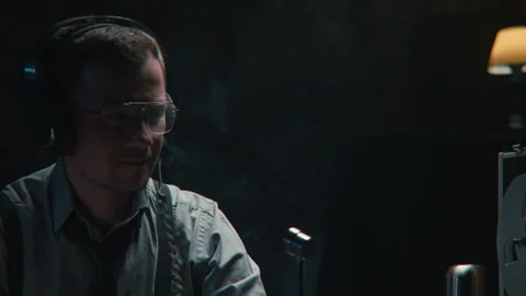 Agent smiling while wire tapping 스톡 동영상 258228723