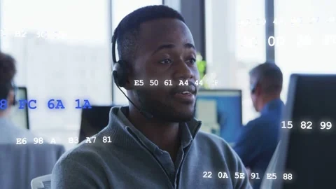 Agent speaking into mic after alert, handling support while code overlay Stock Footage 333145169