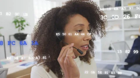 Agent taking call, moving mic and talking while hex code floating over agent and Stock Footage 333529055