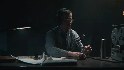 Agent using the wire tapping device Stock Footage 258169821