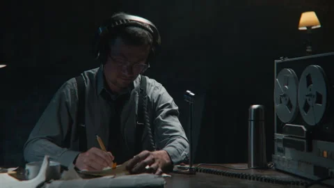 Agent writing something down and wire tapping Stock-Footage 258168952