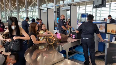 Agents checkpoint inspect passengers in Kuala Lumpur Intl. airport, Malaysia 4K Stock Footage 251717742