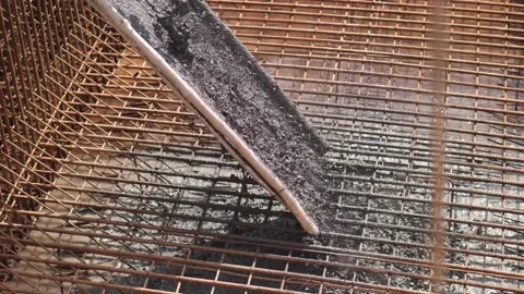 Aggregate Being Added To Cement Though Wire Reinforcement Mesh At Stock Footage 164961888