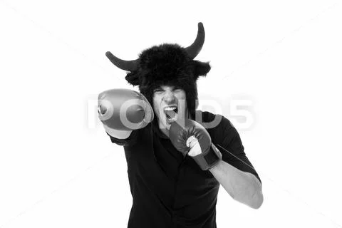 Aggression and masculinity. Man horns as devil or bull aggressive threaten Stock Photos