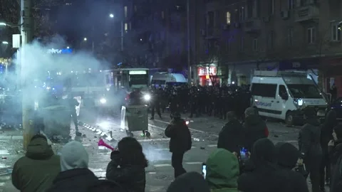 Aggression between young hooligans and police on a boulevard in Sofia Stock Footage 324558631