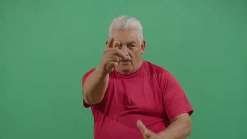 Aggressive adult man executing the viewer with the hand in shape of a gun in Video stock 115346641