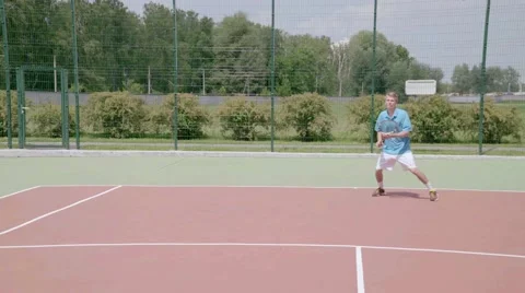 Aggressive baseliner use forehand and backhand shots. Slow motion Stock Footage 58282891