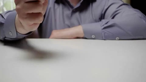 Aggressive behavior of a businessman in negotiations. A man in a gray shirt Stock Footage 130989343