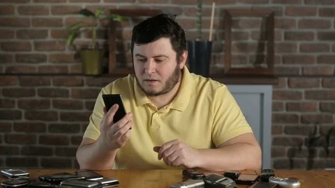 Aggressive boss is shouting on his mobile phone. Nervous stress at work. 스톡 동영상 128094739