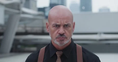 Aggressive businessman look at camera anger man self-assurance relentless Stock Footage 276524929